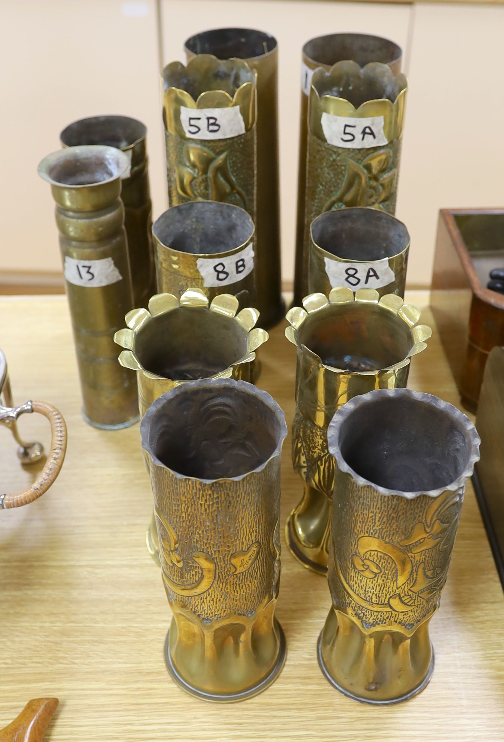 Collection of twelve WW1 trench art shell casings, tallest 31 cms high.
